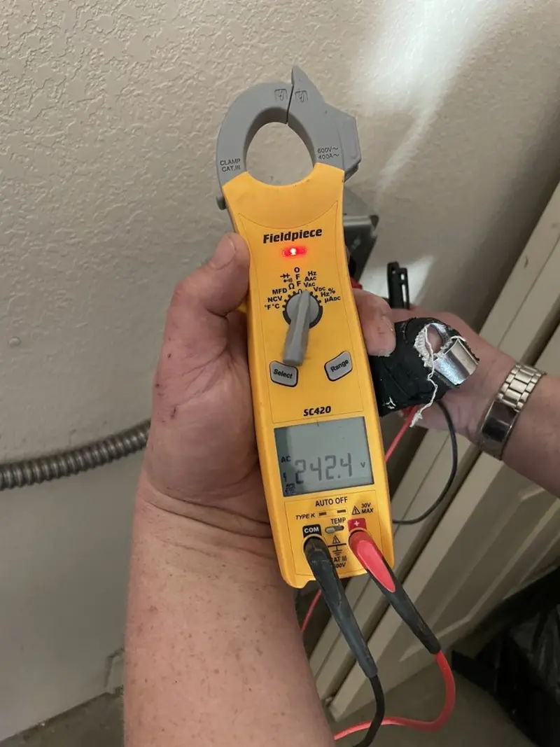 Voltage testing with clamp meter during Ceiling Fan Installation in Woolwich